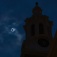 Hayes Hall in the foreground, the total solar eclipse behind. 