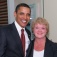 President Obama and Nancy Nielsen pose together for a photo. 