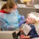 A young girl receives a dental checkup at the Give Kids a Smile event. 