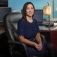 Beth Smith is sitting at her office desk. 