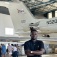 Zoom image: University at Buffalo PhD student Festus Adegbola stands in front of NASA’s G-III research aircraft. He is using airborne imagery collected from this aircraft to study bird diversity in South Africa’s Greater Cape Floristic Region. Photo: Adam Wilson 