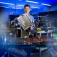 Chi Zhou, pictured in a lab, hold a panel of wheat-straw printed material. 