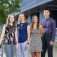 Pharmacy students and faculty member pose in front of the Pharmacy building. 