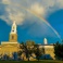 The clock tower of Hayes Hall is photographed with a rainbow after a rainstorm in August 2022. Photographer: Douglas Levere. 