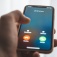 A hand holds a phone as an incoming call shows up on the screen. 