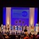 Overhead view of students on stage at previous Buffalo Educational Opportunity Center commencement. 