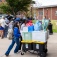 Students move their belongings into a dorm. 