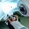 A young woman is undergoing radiation therapy for cancer in a modern cancer hospital. 