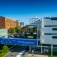 UB's Center of Excellence in Bioinformatics and Life Sciences. A banner across the bridge between two buildings says "Innovation Starts Here.". 