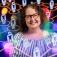 Shira Gabiel surrounded by a graphic of interconnected human figures. 