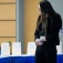A conference participant observes the remembrance luminaries. 