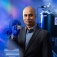 Sambandamurthy Ganapathy holds a neuromorphic computer chip. 