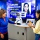 A student shows Gov. Kathy Hochul a tabletop robot named Misty. 