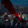 Promotional image for the 2023 film, "The Settlers" featuring three people riding horses. 