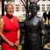 Lillian Williams poses with a bust of Mary Burnett Talbert. 