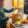 A student uses a compost bag to get rid of food scraps. 