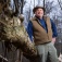 Nick Henshue leans against a downed tree. 