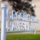 Campus sign reading "Crosby Hall" and "Hayes Hall" points towards the two buildings on UB South Campus. 