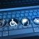 A computer keyboard with icons representing hearing, mobility, cognition and sight. 