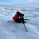 Zoom image: Director Kathy Kasic films "The Memory of Darkness, Light and Ice" on the Greenland Ice Sheet. The documentary, which features the work of UB researchers, recent won an Emmy Award. Photo: Kathy Kasic 