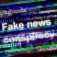 Concept if minsinformation spreading quickly featuring words like "Fake News," "conspiracy," "propaganda" at an angle with a slight motion blur. 