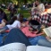Buffalo Reading Invasion participants reading outdoors. 