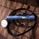 A GLP-1 injector and a stethoscope on a wooden tabletop. 