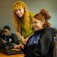 An EOP Summer Bridge mentor smiles while helping a student,. 