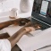 A person using a laptop to start a Linkedin account. 