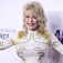Dolly Parton posing for photographers in February 2026. 