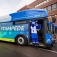 Victor E. Bull stands on the steps of one of the new electric Stampede buses. 